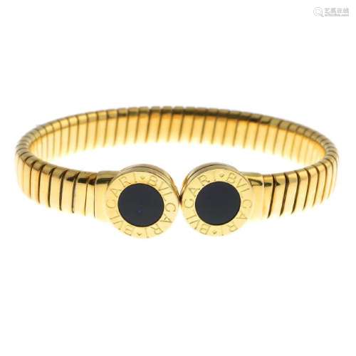 BULGARI - an 18ct gold 'Bulgari Bulgari' bangle. The