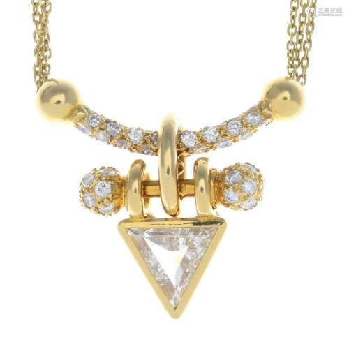 A diamond necklace. The triangular-shape diamond