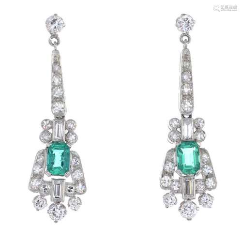 A pair of Colombian emerald and diamond earrings. Each
