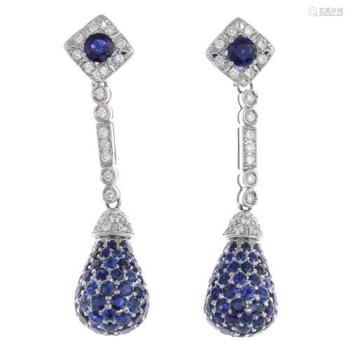 A pair of sapphire and diamond earrings. Each designed