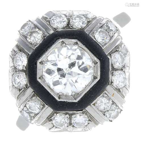 An Art Deco platinum diamond cluster ring. The old-cut