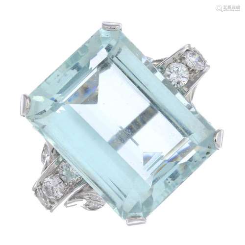 An aquamarine and diamond cocktail ring. The