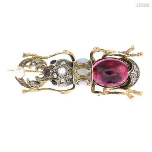 A diamond and gem-set stag beetle brooch. The oval