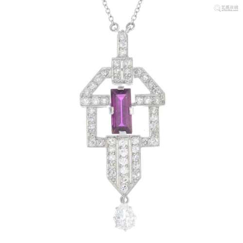 A ruby and diamond pendant. Of geometric design, the