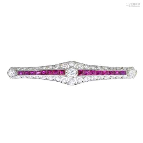 A platinum and gold Art Deco diamond and ruby brooch.