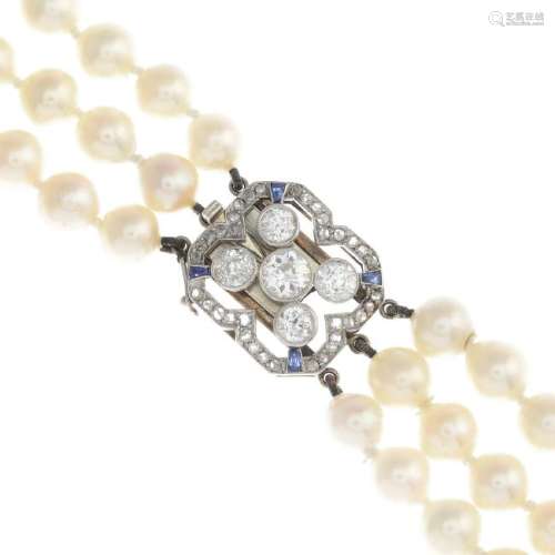 A cultured pearl necklace. Comprising three strands of