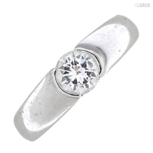 An 18ct gold diamond single-stone ring. The