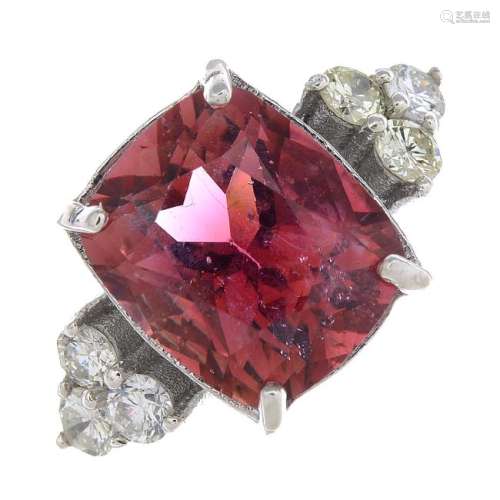 A tourmaline and diamond ring. The cushion-shape pink