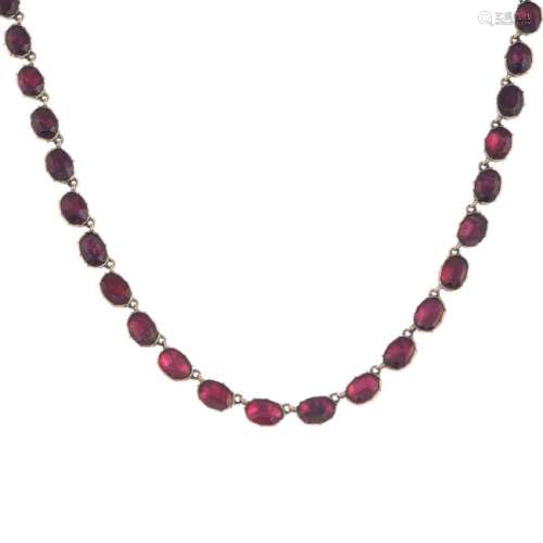 A late Georgian gold garnet necklace. The oval-shape