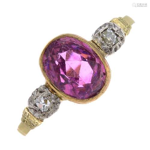 A tourmaline and diamond three-stone ring. The