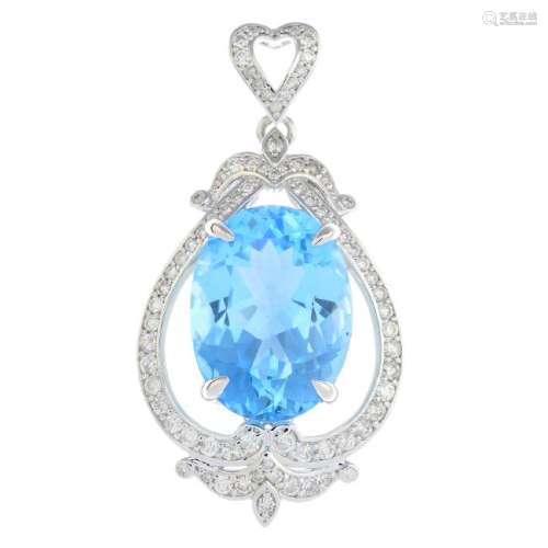A topaz and diamond pendant. The oval-shape blue topaz,