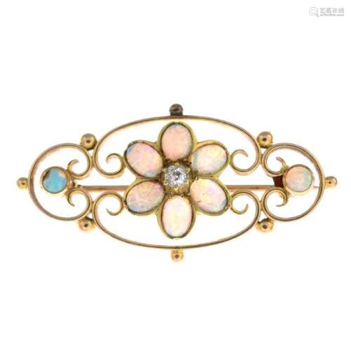 An opal and diamond brooch. The old-cut diamond and