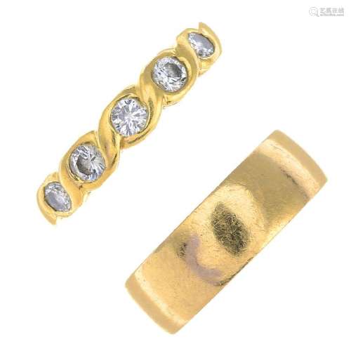 (64334) An 18ct gold band ring and an 18ct gold