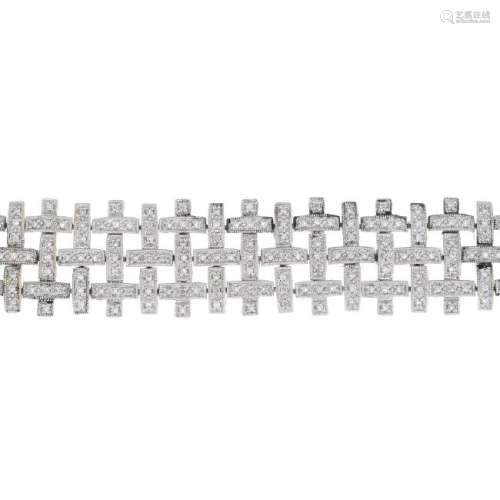 A diamond bracelet. Designed as three rows of