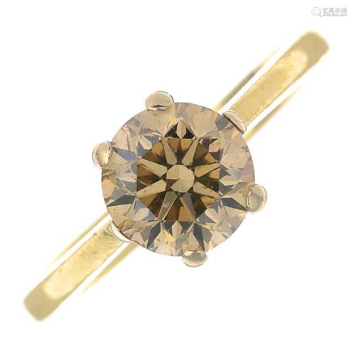 A coloured diamond single-stone ring. The brilliant-cut