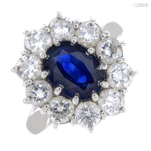 (64015) A platinum sapphire and diamond ring. The