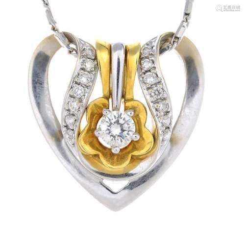 A diamond pendant, with chain. Of bi-colour design, the
