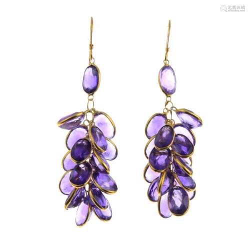 A pair of amethyst earrings. Each designed as a cluster