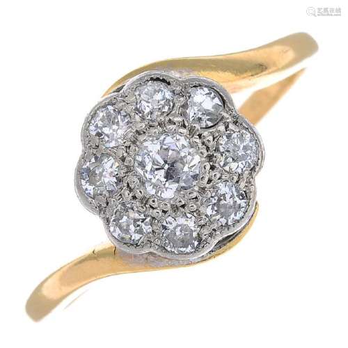 A mid 20th century 18ct gold diamond cluster ring. The