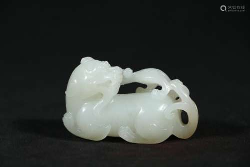 A Chinese Carved Jade Foo-Dog