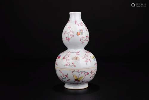 A FAMILLE-ROSE BUTTERFLY DOUBLE-GOURD VASE.MARK OF