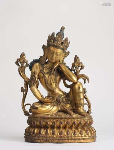 A MAGNIFICENT EARLY MING GILT-BRONZE FIGURE OF POTALAKA