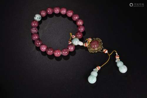 A RUBY BEAD COURT BRACELET.QING DYNASTY