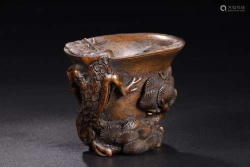 A CARVED AGALLOCH PINE TREE CUP.ANTIQUE