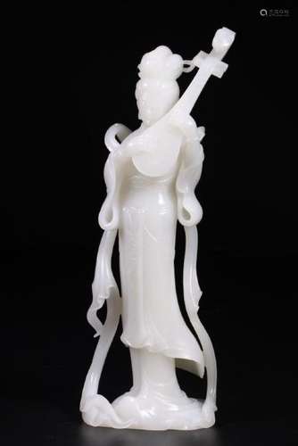 A WHITE JADE CARVING OF BEAUTY.