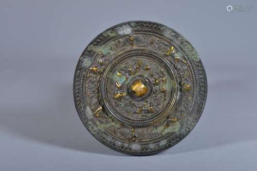 A GILT-BRONZE MIRROR, HAN DYNASTY