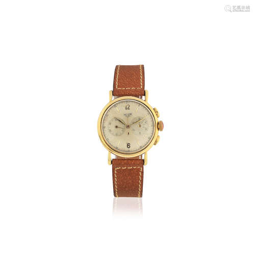 Circa 1940  Heuer. An early 18K gold manual wind chronograph wristwatch