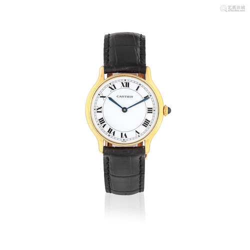 Circa 1990  Cartier. An 18K gold manual wind wristwatch