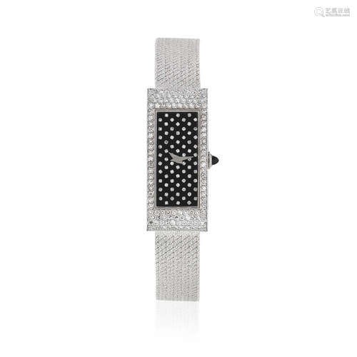 Ref: 17135B47, Circa 1980  Corum. A lady's 18K white gold and diamond set manual wind bracelet watch