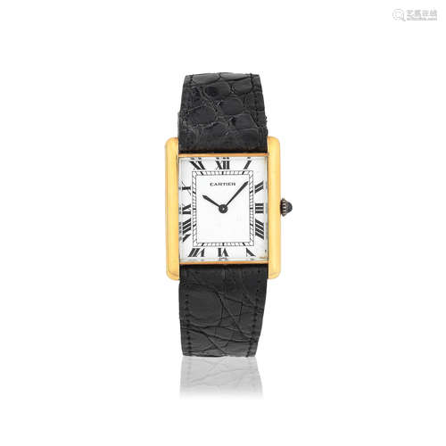 Circa 1980  Cartier. An 18K gold automatic rectangular wristwatch