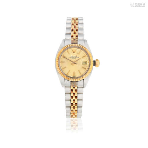 Date, Ref: 6916, Sold 9th May 1986  Rolex. A lady's stainless steel and gold automatic calendar bracelet watch