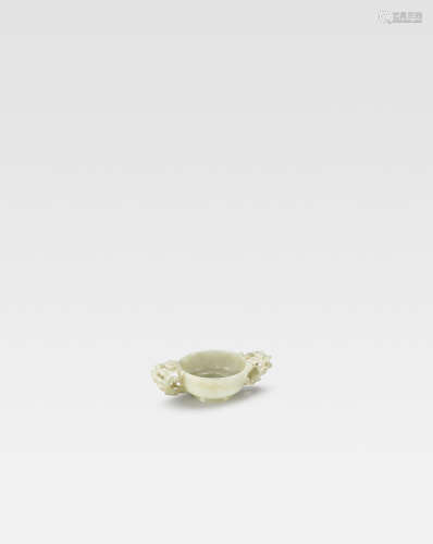 Ming Dynasty  A pale green jade chilong-handled cup