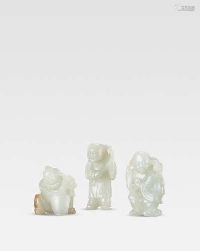 Qing Dynasty  A  group of pale green jade figures of 'Liu Hai' and two boys