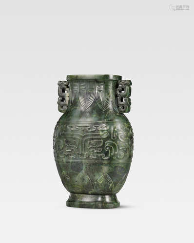 Incised Jiaqing fanggu six-character mark and of the period A rare spinach-green jade archaistic baluster vase, hu