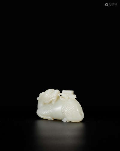 Qianlong A very fine white jade carving of a qilin carrying the Heavenly Books