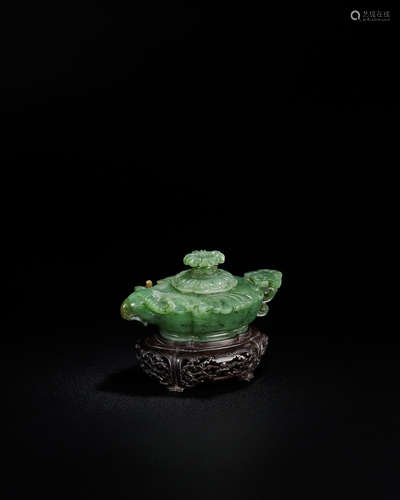 Qianlong An exceptional Imperial spinach-green jade 'ram's head' water dropper and cover