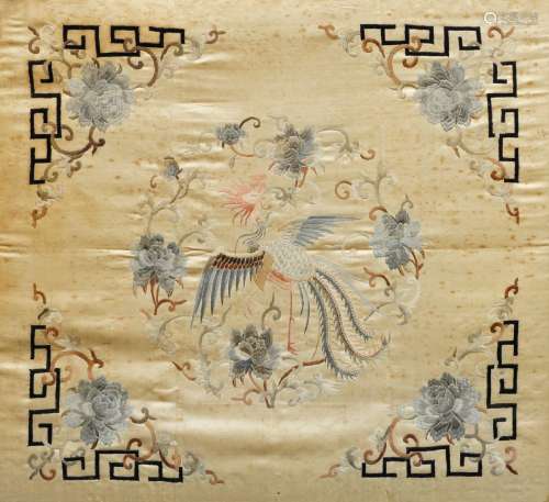 A Chinese silk embroidered panel, late 19th century, centered with a phoenix panel surrounded by