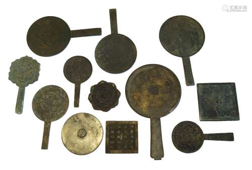 Twelve Chinese bronze mirrors, 19th/20th century, some with handles, to include square examples, 8.