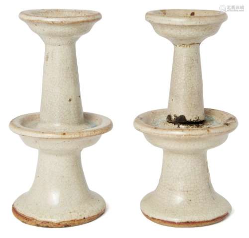 A pair of Chinese stoneware candlesticks, late Yuan/ early Ming dynasty, of two-tiered circular