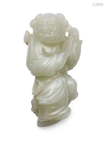 A Chinese pale celadon carving of a boy, 18th century, carved standing, holding a lingzhi sprig over
