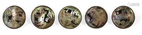A set of four Thai gold and mother of pearl dress buttons, 19th century, each decorated with a