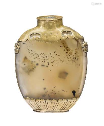 A Chinese agate ovoid snuff bottle, mid-19th century, the brass mounts decorated with ruyi-shaped
