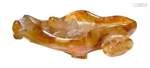 A Chinese agate brushwasher, early 20th century, carved as a lotus with seed pod and two frogs,