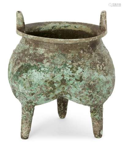 A Chinese archaic bronze ritual food vessel, li, Shang dynasty, of tri-lobed form, with raised