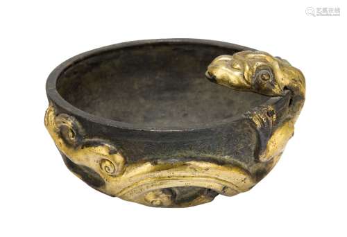 A Chinese silvered metal Tang style bowl, applied to the rim with a gilt repousse chi-long dragon