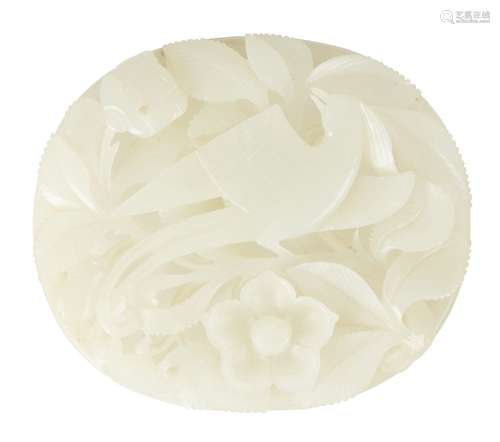 A Chinese pale celadon hardstone oval plaque, late Qing dynasty, carved with a phoenix amid